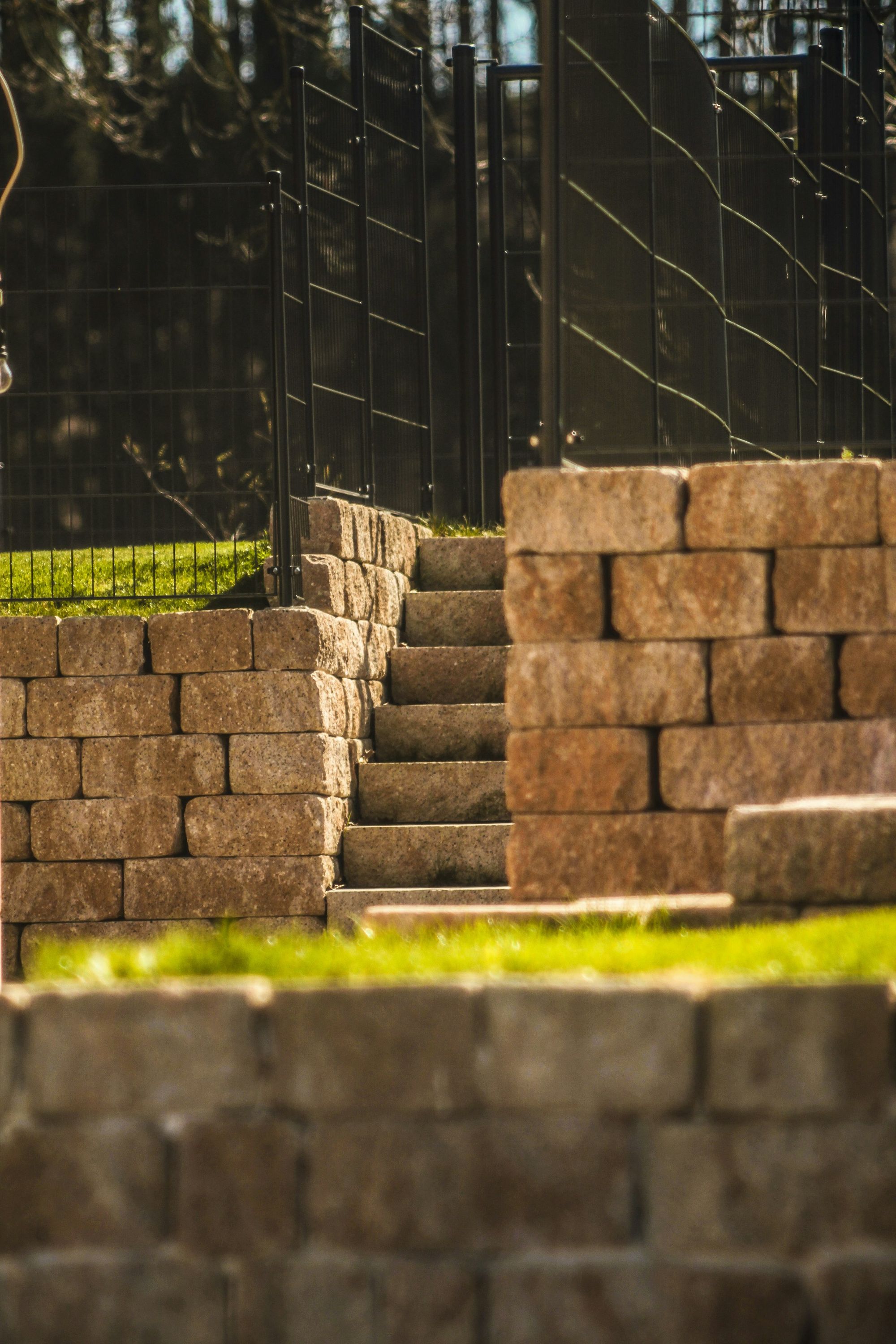 A stone retaining wall with steps