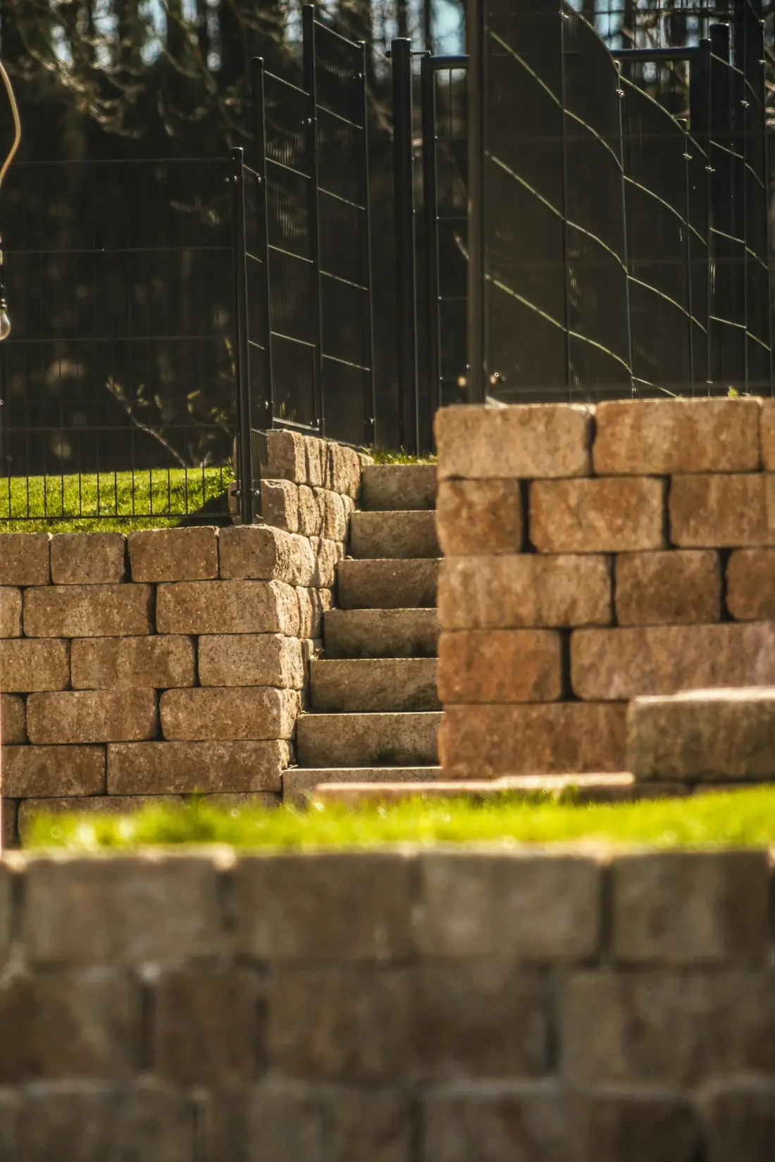 A stone retaining wall with steps